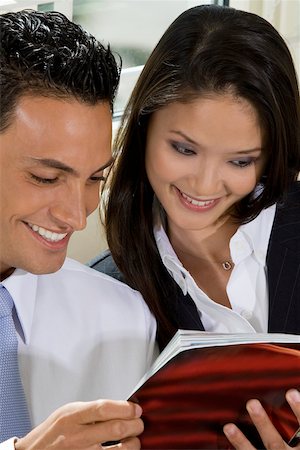 simsearch:625-00850993,k - Close-up of a businessman and a businesswoman reading a book Stock Photo - Premium Royalty-Free, Code: 625-00850426