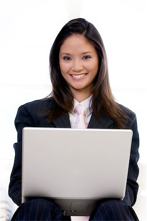 Portrait of a businesswoman using a laptop Stock Photo - Premium Royalty-Free, Code: 625-00850623