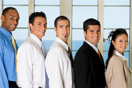 simsearch:625-00851478,k - Side profile of four businessmen and a businesswoman standing in a row Stock Photo - Premium Royalty-Free, Code: 625-00850658