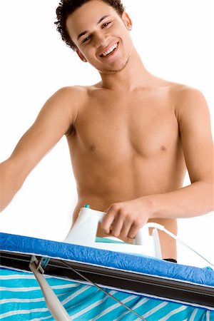 simsearch:625-00841323,k - Low angle view of a young man ironing Stock Photo - Premium Royalty-Free, Code: 625-00850753