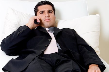 simsearch:625-02266709,k - Portrait of a businessman talking on a mobile phone Foto de stock - Sin royalties Premium, Código: 625-00850998