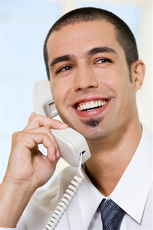 simsearch:625-01093712,k - Close-up of a businessman talking on the telephone Stock Photo - Premium Royalty-Free, Code: 625-00851065