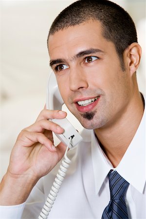 simsearch:625-01093712,k - Close-up of a businessman talking on the telephone Stock Photo - Premium Royalty-Free, Code: 625-00851289