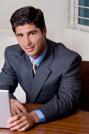 simsearch:625-01096675,k - Portrait of a businessman using a laptop Stock Photo - Premium Royalty-Free, Code: 625-00851341