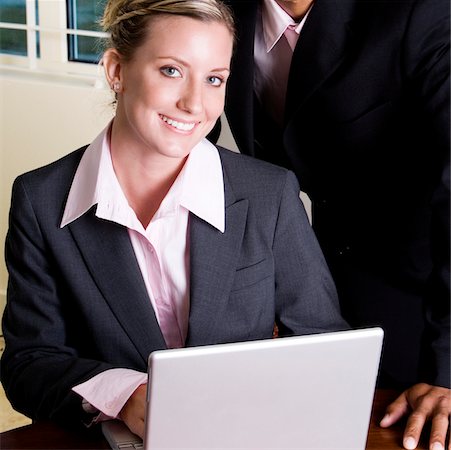 simsearch:625-00851478,k - Portrait of a businesswoman in front of a laptop Stock Photo - Premium Royalty-Free, Code: 625-00851460