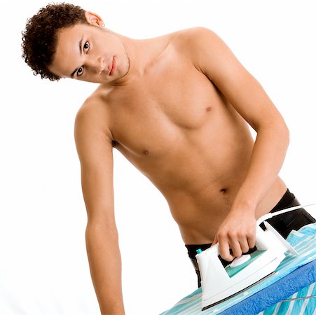 simsearch:625-00841323,k - Portrait of a young man ironing Stock Photo - Premium Royalty-Free, Code: 625-00851498