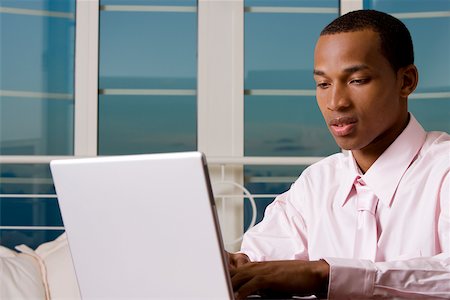 simsearch:625-01096766,k - Close-up of a businessman in front of a laptop Stock Photo - Premium Royalty-Free, Code: 625-00851524