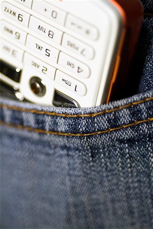 Close-up of a mobile phone in a pocket Stock Photo - Premium Royalty-Free, Code: 625-00898000