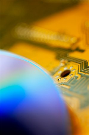 simsearch:625-02926608,k - Close-up of a CD on a circuit board Stock Photo - Premium Royalty-Free, Code: 625-00898517