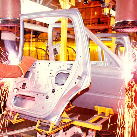 Welder working on car doors in an assembly line, Newark, Delaware, USA Stock Photo - Premium Royalty-Free, Code: 625-00898622