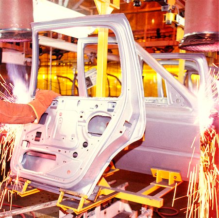 electronics manufacturing - Welder working on car doors in an assembly line, Newark, Delaware, USA Stock Photo - Premium Royalty-Free, Code: 625-00898622