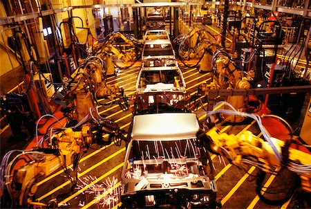 High angle view of robots at work in a plant, GMC Truck Plant, Michigan, USA Foto de stock - Sin royalties Premium, Código: 625-00899025