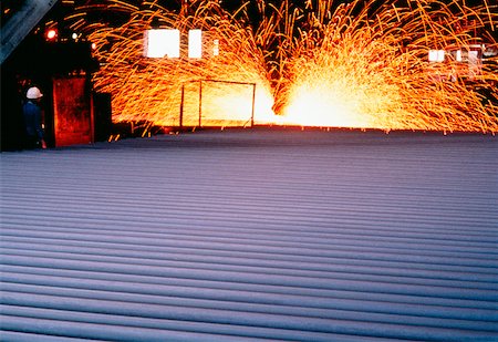 sparks of molten metal - Close-up of a metal sheet in a steel mill Stock Photo - Premium Royalty-Free, Code: 625-00899043