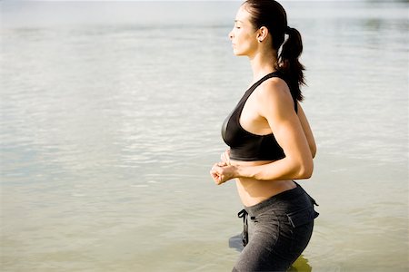 simsearch:625-00839293,k - Side profile of a young woman exercising in a lake Stock Photo - Premium Royalty-Free, Code: 625-00899123