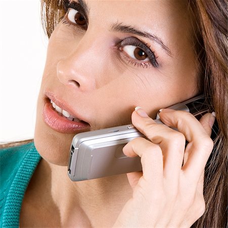 Portrait of a mid adult woman talking on a mobile phone Stock Photo - Premium Royalty-Free, Code: 625-00899218