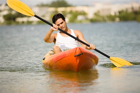 portrait and kayak - Young man kayaking in a lake Stock Photo - Premium Royalty-Free, Code: 625-00899267