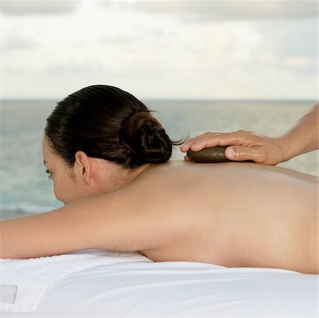 simsearch:625-00901115,k - Close-up of a young woman getting a back massage Stock Photo - Premium Royalty-Free, Code: 625-00899814