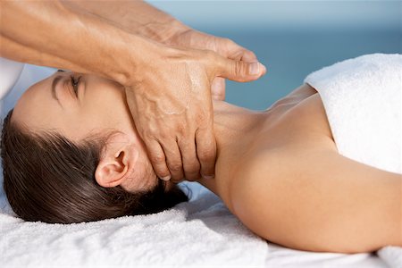 simsearch:625-00901115,k - Close-up of a young woman getting a neck massage Stock Photo - Premium Royalty-Free, Code: 625-00899879