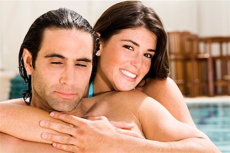 simsearch:625-00842233,k - Portrait of a young woman embracing a mid adult man at the poolside Foto de stock - Sin royalties Premium, Código: 625-00899988