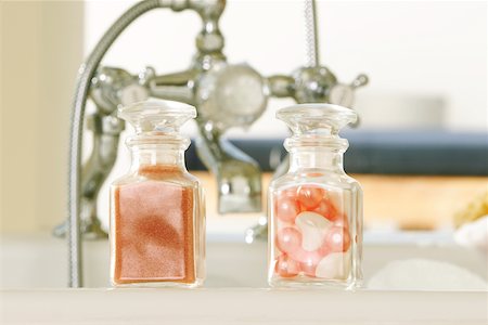 Close-up of soap powder and bath pearls in glass bottles Stock Photo - Premium Royalty-Free, Code: 625-00900489