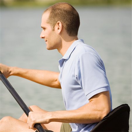 simsearch:625-01095812,k - Profil de côté d'un jeune homme en kayak dans un lac Photographie de stock - Premium Libres de Droits, Code: 625-00900570