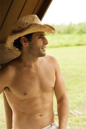 Close-up of a mid adult man wearing a hat Stock Photo - Premium Royalty-Free, Code: 625-00900678