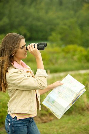 simsearch:625-00902214,k - Side profile of a girl looking through a pair of binoculars Stock Photo - Premium Royalty-Free, Code: 625-00900887