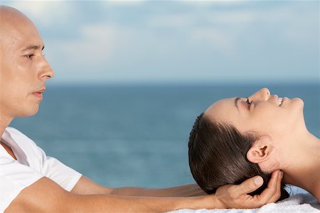 simsearch:625-00901115,k - Close-up of a young woman getting a head massage Stock Photo - Premium Royalty-Free, Code: 625-00900922