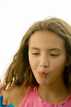 preteens fingering - Close-up of a girl puckering her lips Stock Photo - Premium Royalty-Free, Code: 625-00901049