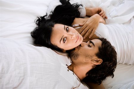 double bedroom - High angle view of a young man kissing a young woman Stock Photo - Premium Royalty-Free, Code: 625-00901172