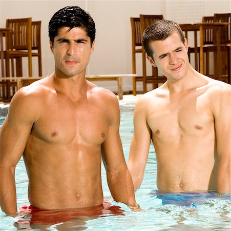Close-up of two young men in a swimming pool Stock Photo - Premium Royalty-Free, Code: 625-00901357