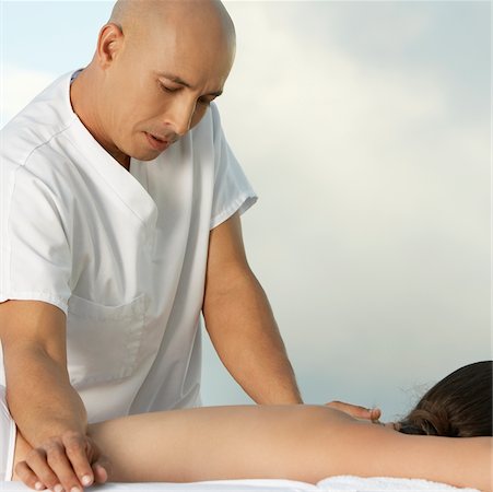 simsearch:625-00901115,k - Mature man giving a young woman a back massage Stock Photo - Premium Royalty-Free, Code: 625-00901360