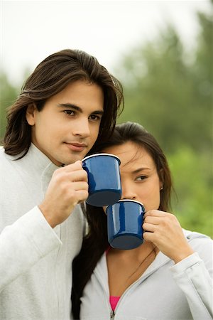 Close-up of a young couple drinking coffee Stock Photo - Premium Royalty-Free, Code: 625-00901574