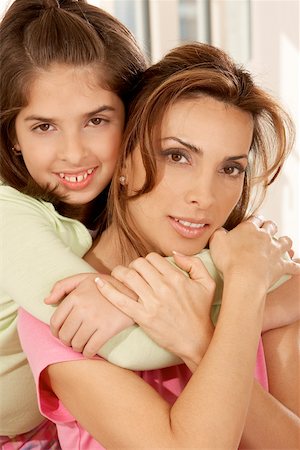 simsearch:632-02416107,k - Portrait of a daughter hugging her mother from behind Stock Photo - Premium Royalty-Free, Code: 625-00901694