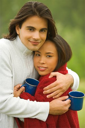 Portrait of a young couple embracing each other Stock Photo - Premium Royalty-Free, Code: 625-00901865