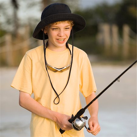 simsearch:640-02764424,k - Close-up of a boy fishing Stock Photo - Premium Royalty-Free, Code: 625-00901895