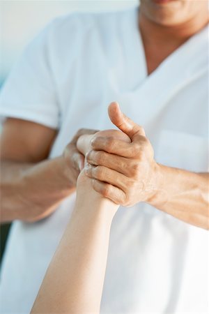 simsearch:625-00901115,k - Mid section view of a massage therapist giving foot massage to a woman Stock Photo - Premium Royalty-Free, Code: 625-00901935