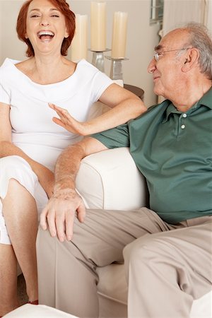 elderly woman seated in armchair - Portrait of a senior couple laughing Stock Photo - Premium Royalty-Free, Code: 625-00902179