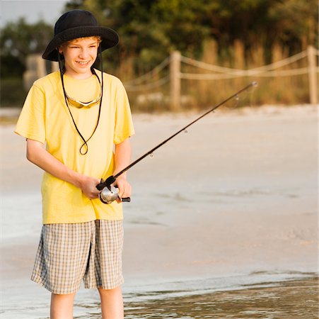 simsearch:640-02764424,k - Close-up of a boy fishing Stock Photo - Premium Royalty-Free, Code: 625-00902246