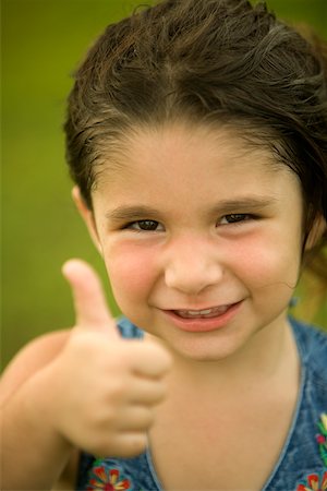 decision little girl - Portrait of a girl making a thumbs up sign Stock Photo - Premium Royalty-Free, Code: 625-00902448