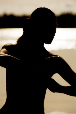 silhouette female martial arts - Silhouette of a young woman practicing martial arts on the beach Stock Photo - Premium Royalty-Free, Code: 625-00902888