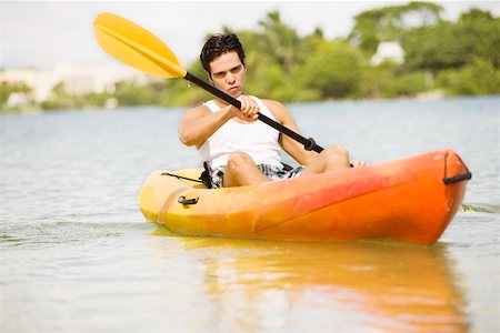 portrait and kayak - Portrait of a young man kayaking Stock Photo - Premium Royalty-Free, Code: 625-00902952