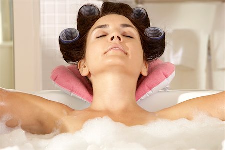 Close-up of a young woman relaxing in a bubble bath Stock Photo - Premium Royalty-Free, Code: 625-00903020