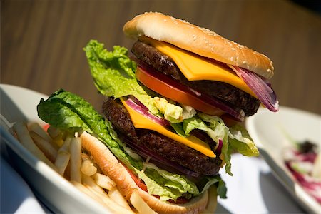 plate of hamburger and fries - Close-up of a hamburger and French fries Stock Photo - Premium Royalty-Free, Code: 625-00903193