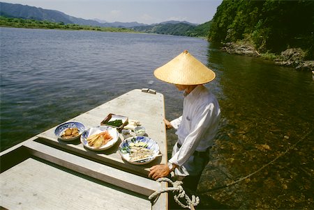 shimanto river - Mature man standing near a boat, Shimanto River, Kochi, Shikoku, Japan Stock Photo - Premium Royalty-Free, Code: 625-00903655