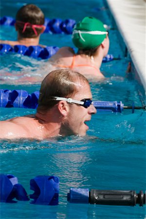 simsearch:625-01038267,k - Side profile of a mid adult man in a swimming pool Stock Photo - Premium Royalty-Free, Code: 625-01038045