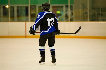 simsearch:625-01038051,k - Rear view of an ice hockey player playing ice hockey Stock Photo - Premium Royalty-Free, Code: 625-01038068