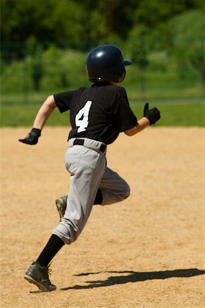 Rear view of a baseball player running Stock Photo - Premium Royalty-Free, Code: 625-01038139