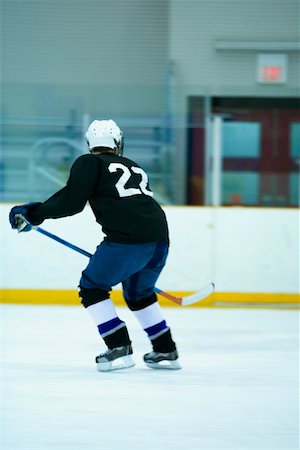 simsearch:625-01038051,k - Rear view of an ice hockey player playing ice hockey Stock Photo - Premium Royalty-Free, Code: 625-01038130