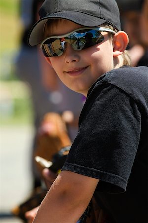 simsearch:625-01038259,k - Close-up of a baseball player wearing sunglasses and smiling Stock Photo - Premium Royalty-Free, Code: 625-01038148